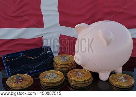 Bitcoin And Cryptocurrency Investing. Denmark Flag In Background. Piggy Bank, The Of Saving Concept.