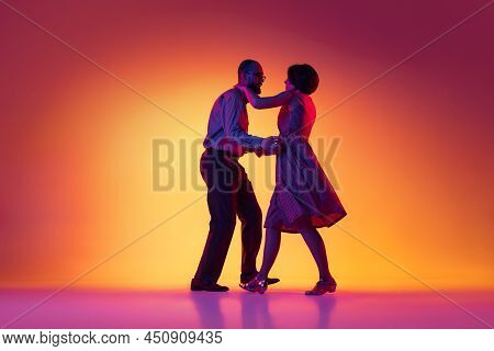 Portrait Of Excited Man And Woman, Couple Of Dancers In Vintage Retro Style Outfits Dancing Lindy Ho