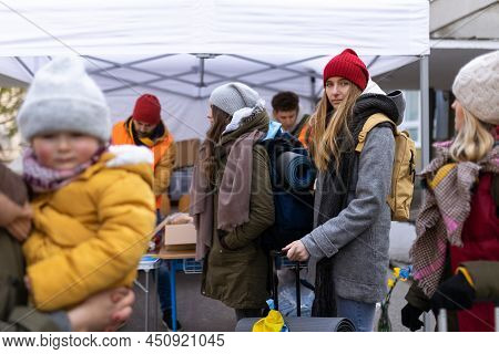 Ukrainian Immigrants Crossing Border And Getting Donations From Volunteers, Ukrainian War Concept.