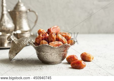 Ramadan Palm Fruit Dates In Silver Bowl And Zam Zam Water  Symbolize Sacred Month For Muslims. Ramad