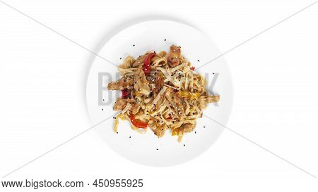 Wok Noodles With Chicken Isolated On A White Background. Pasta With Chicken Fillet.