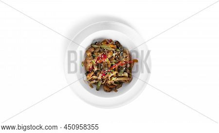 Wok Noodles With Seafood Isolated On A White Background. Pasta With Shrimp And Mussels.