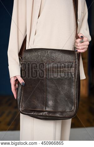 Close-up Photo Of Brown Messanger Leather Bag On Womans Shoulder