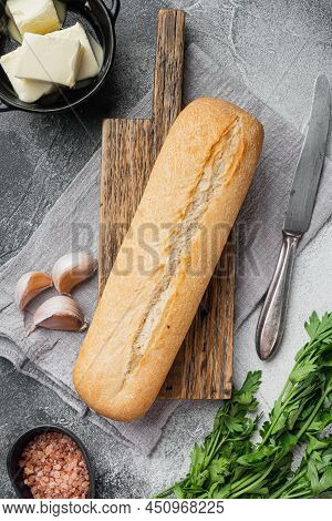 Ingredients For Garlic And Gerbs Bread Baguette Set, On Gray Stone Table Background, Top View Flat L