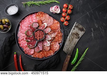 Dry Cured Sausage Sliced Chorizo, Fuet, Salami On Balck Background, Flat Lay.