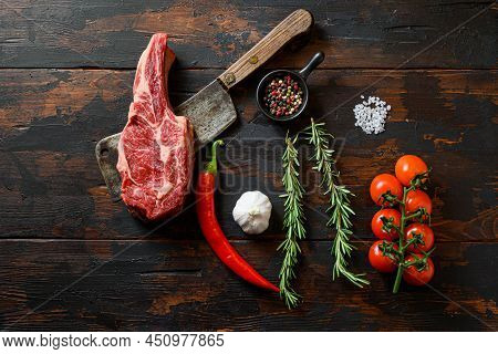 Raw Delmonico Steak On Meat Cleaver. Organic Farm Marbled Prime Black Angus Beef. Dark Wooden Backgr