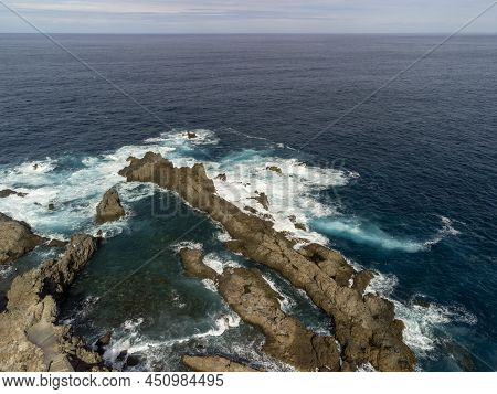 Aerial View On Charco Del Viento Natural Pool In Black Lava Rocks On Tenerife, Canary Islands, Spain