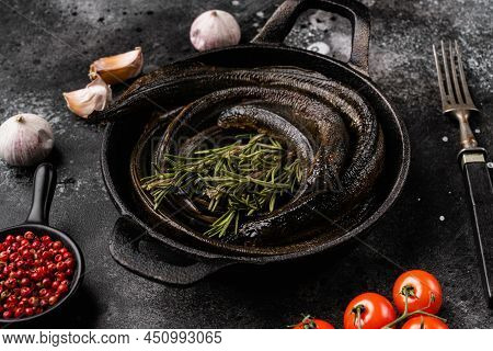 Fried River Lamprey Set, On Black Wooden Table Background