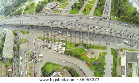 Day traffic on street and overpass bridge. View from unmanned quadrocopter.