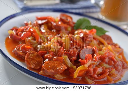 Lecso with spiced sausage on a plate