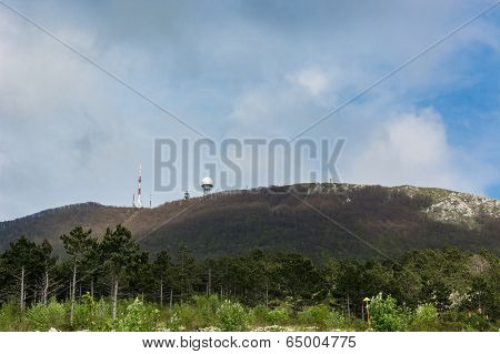Radio Antenna And Radar On Top Of A Mountain