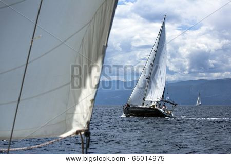 AEGEAN SEA, GREECE - MAY 5, 2014: Unidentified sailboats participate in sailing regatta 