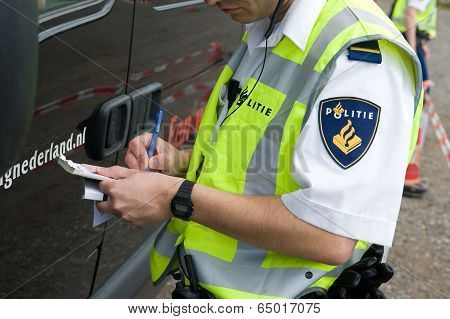 Policeman Is Checking Driving License