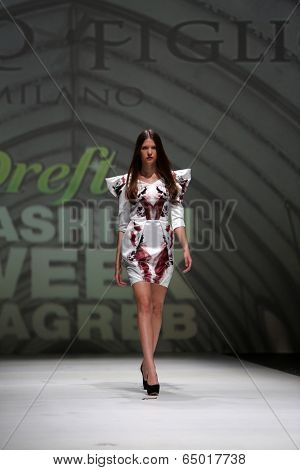 ZAGREB, CROATIA - MAY 09: Fashion model wearing clothes designed by Avaro Figlio on the Zagreb Fashion Week on May 09, 2014 in Zagreb, Croatia.