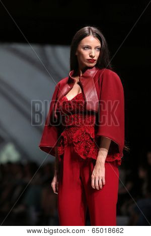 ZAGREB, CROATIA - MAY 09: Fashion model wearing clothes designed by Avaro Figlio on the Zagreb Fashion Week on May 09, 2014 in Zagreb, Croatia.