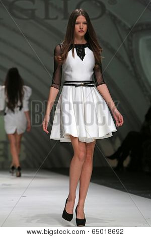 ZAGREB, CROATIA - MAY 09: Fashion model wearing clothes designed by Avaro Figlio on the Zagreb Fashion Week on May 09, 2014 in Zagreb, Croatia.