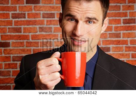 Businessman with cop of coffee