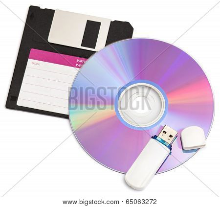 Cd Disks Floppy And Flash Drive On White Background