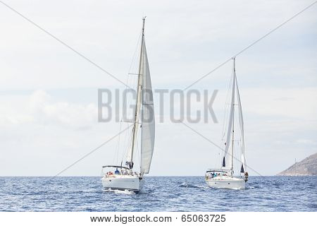 AEGEAN SEA, GREECE - APR 27, 2014: Unidentified sailboats participate in sailing regatta 
