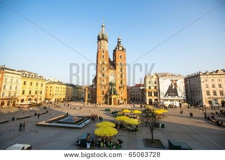 KRAKOW, POLAND - FEB 26, 2014: View of the Main Square. It dates to the 13th century, and at roughly 40,000 m it is the largest medieval town square in Europe.