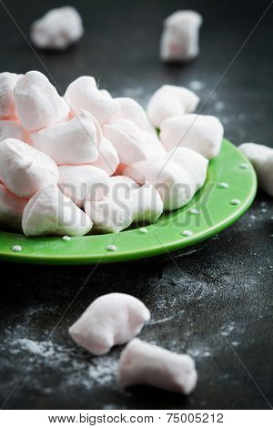 Homemade pink marshmellows on dark rustic background