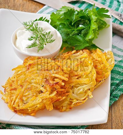 Fragrant potato pancakes with sour cream and herbs