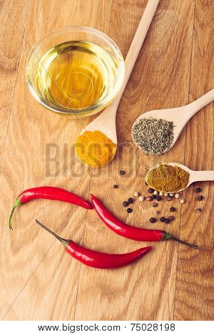 Fresh and dried hot chili peppers witn herbs, spices