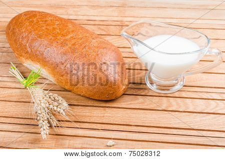 Fresh bread with grains and milk
