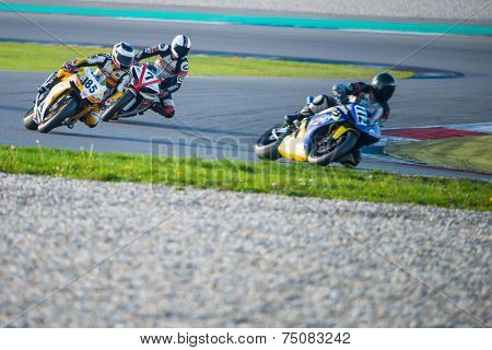 ASSEN, NETHERLANDS - OCTOBER 19, 2014: Competitors racing through the apex of the 1000cc superbike races on the TT Assen circuit