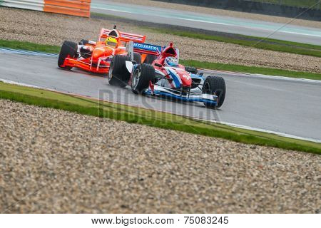 ASSEN, NETHERLANDS - OCTOBER 19, 2014: Team Netherlands in pursuit of Team Great Britain during the final race of the Formula A1 GP Acceleration tour.