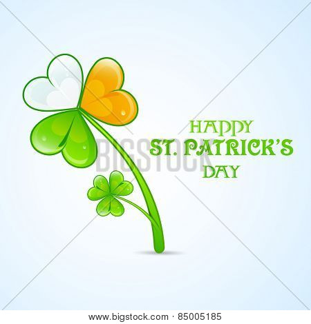 Beautiful shamrock leaf in Irish Flag colors on blue background for Happy St. Patrick's Day celebration.