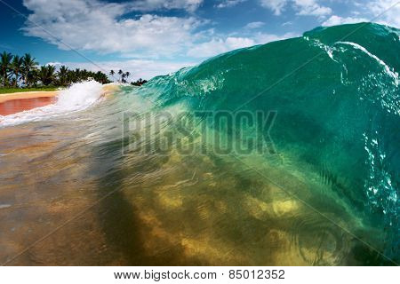 Blue ocean wave breaking on the sandy tropical beach. Sri Lanka