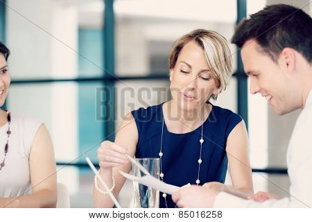 Businesswoman doing a presentaion in front of her collegues