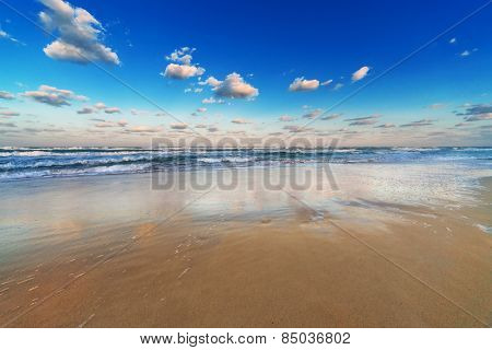 reflection of the sky in the sand beach