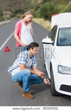 Couple after a car breakdown at the side of the road