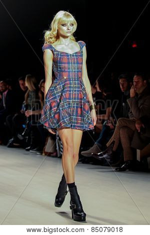 NEW YORK - FEBRUARY 13: A model walks the runway at the Mark & Estel Fall/Winter 2015 collection during Mercedes-Benz Fashion Week in New York on February 13, 2015.