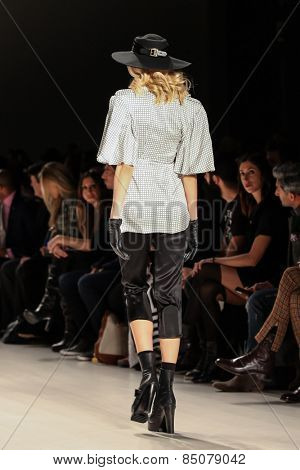 NEW YORK - FEBRUARY 13: A model walks the runway at the Mark & Estel Fall/Winter 2015 collection during Mercedes-Benz Fashion Week in New York on February 13, 2015.
