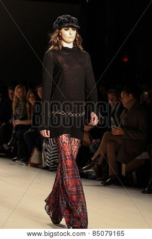 NEW YORK - FEBRUARY 13: A model walks the runway at the Mark & Estel Fall/Winter 2015 collection during Mercedes-Benz Fashion Week in New York on February 13, 2015.