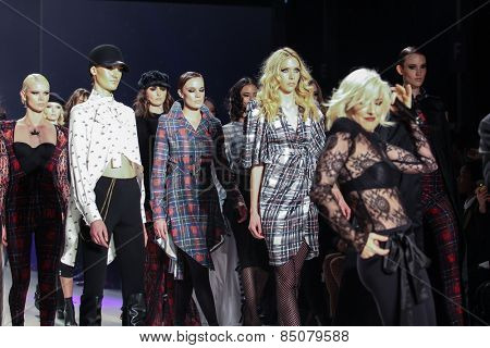 NEW YORK - FEBRUARY 13: A models and designer Estel Day walks the runway at the Mark & Estel Fall/Winter 2015 collection during Mercedes-Benz Fashion Week in New York on February 13, 2015.