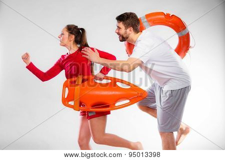 Lifeguards Running With Equipment