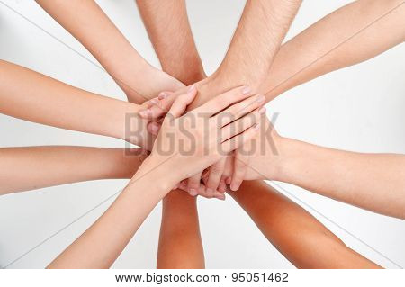 Top view of putting hands on each other
