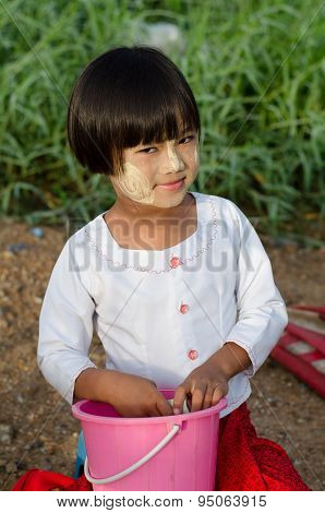 young asian girl with thanaka powder on face