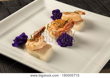 Grilled Shrimp With Raw Nail Fish On White Plate At Table