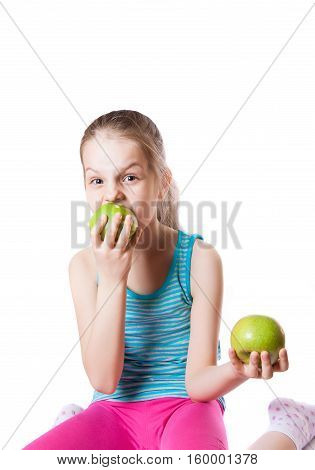 girl biting a green apple Isolation on a white background