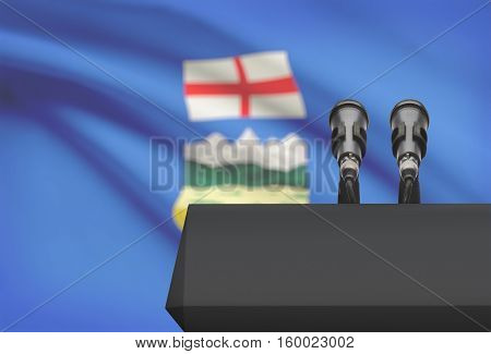 Pulpit And Two Microphones With Canadian Province Flag On Background - Alberta