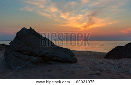 Sunset over the Sea of Azov on Generals beach. Karalar regional landscape park in the Crimea.