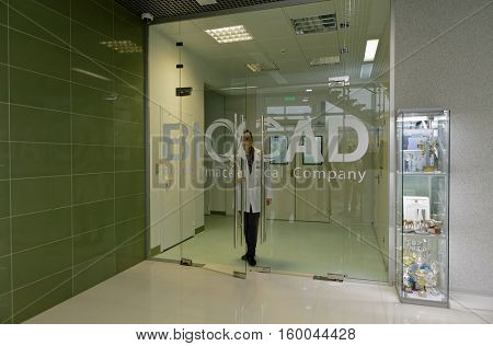 ST. PETERSBURG, RUSSIA - NOVEMBER 16, 2016: Staff go out from the production site of biotechnology company BIOCAD. It is one of the world`s few full-cycle drug development and manufacturing companies