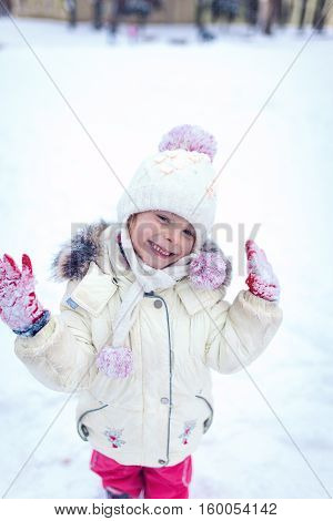 Little girl having fun on winter day