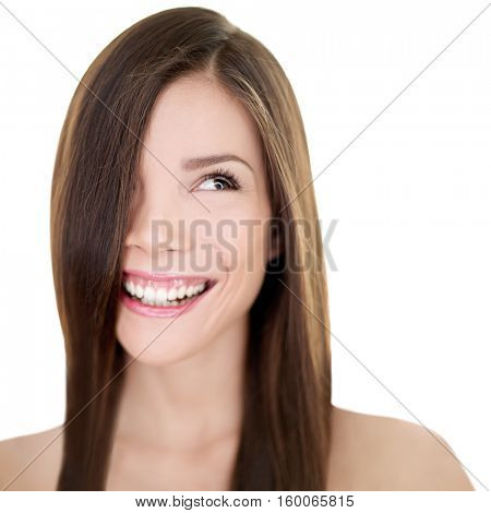 Hair care Asian woman smiling looking at white background copyspace. Beautiful girl with long straight brown hair for haircut or hairstyle beauty salon concept. Happy natural smile person.