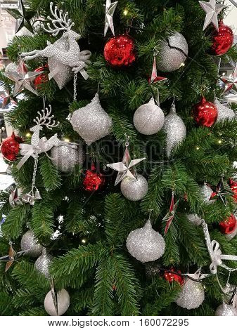 Embellished Christmas tree decoration glitter silver ornaments and red ball (long shot)